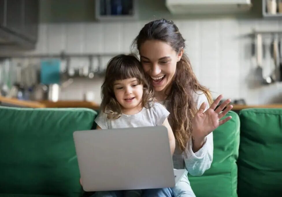 Baby and mother talking in online smiling